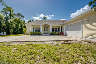 Ranch-style home featuring concrete driveway, an a