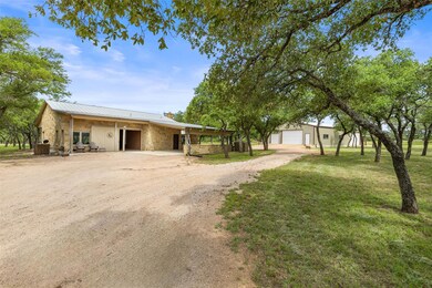 View of front of property featuring a detached ga
