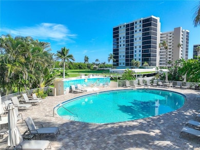 Community pool with a patio