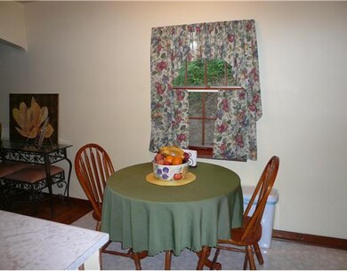 Dining Room. The cozy dining area is open to the k