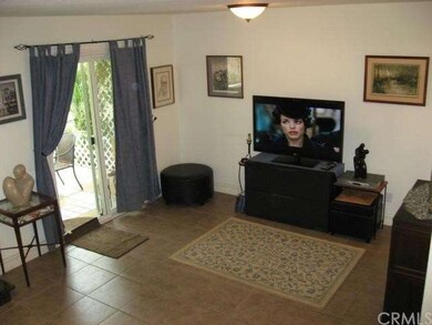Spacious living room looking to back patio off gre