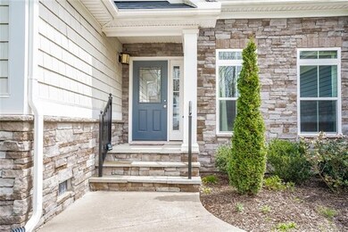Covered front porch with stone steps