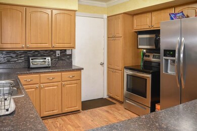 Stainless steel appliances in the kitchen.