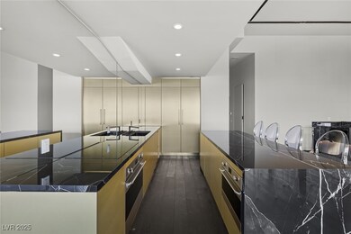 Kitchen with cream cabinets, stainless steel oven,
