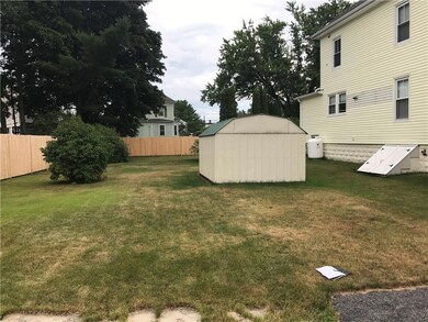 Large yard with storage shed that...