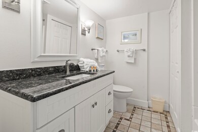 Bathroom featuring vanity, tile patterned flooring