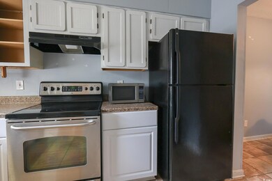 Kitchen featuring baseboards, tile patterned floor