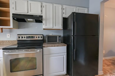 Kitchen featuring baseboards, tile patterned floor