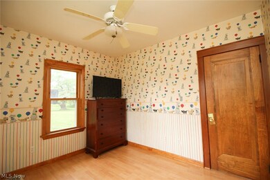 Unfurnished room featuring light hardwood / wood-style floors and ceiling fan