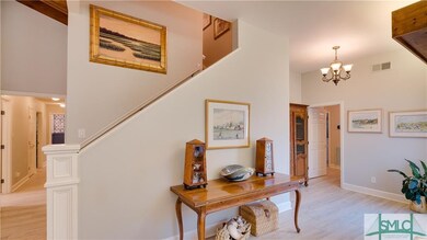 Entry to the open foyer, stairway leads to large f