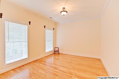 Only a few steps into the home and you'll find a formal sitting room that would also make a great office.