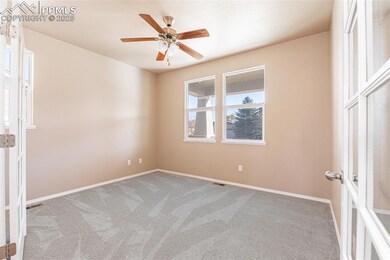 New light colored carpet and ceiling fan.  Make this room anything you want