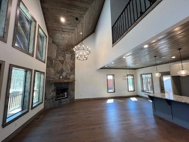 Unfurnished living room with dark wood-style floor