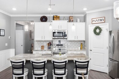 Kitchen featuring tile backsplash, walk in pantry