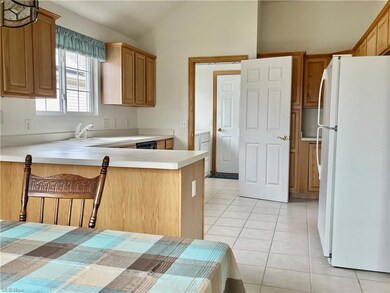 Open Kitchen eating area with plentiful cupboards,