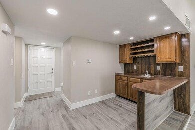 Bar with sink and cabinets