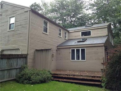 Exterior Back. Home needs some to be...
