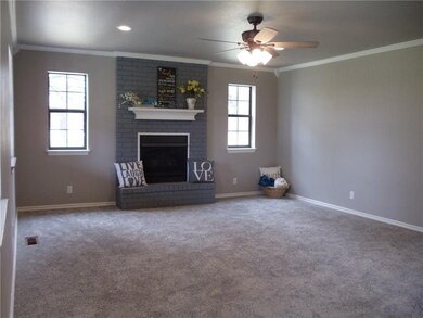 Spacious Living room with fireplace has new carpet
