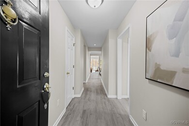Hall featuring light wood-type flooring