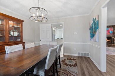 Dining space featuring a textured ceiling, visible
