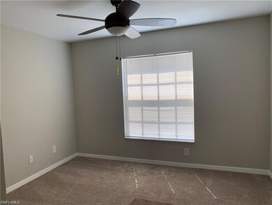 Unfurnished room with carpet floors and ceiling fa