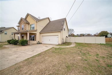 View of front of property featuring covered porch and a front yard