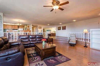 Living room open to dining, kitchen and family roo