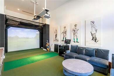 Rec room featuring ornamental molding, golf simula