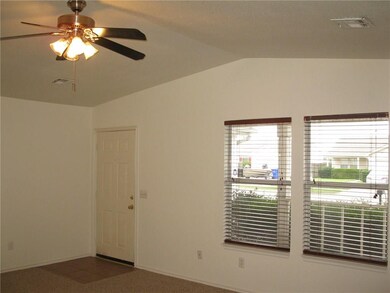 The tiled entry way and vaulted ceiling with ceili