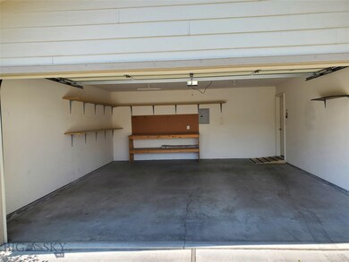 Garage Interior with Workbench and Shelving.