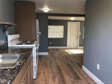 As you come in you'll pass the kitchen and see the rest of the unit further in.