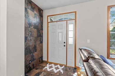 Step inside to a welcoming tile entryway that offers both style and durability, setting the tone for the thoughtful finishes found throughout the home.