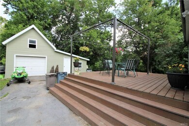 Large deck with detached garage.