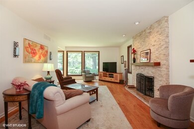 9' ceilings, gorgeous wood flooring and floor-to-c