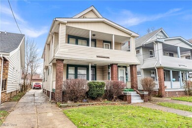 View of front of home featuring a front lawn and a porch