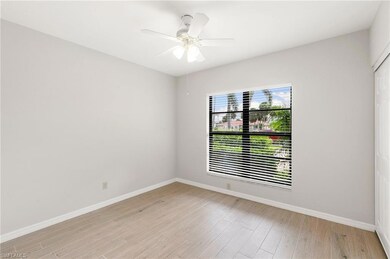 Empty room featuring light wood-style flooring and ceiling fan
