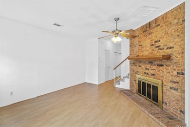 Unfurnished living room featuring stairway, a ceil