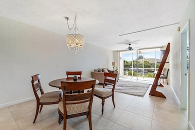 Dining room / living room area with tile flooring