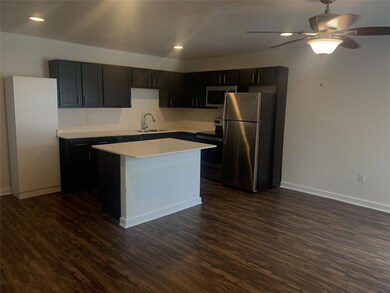 Kitchen with appliances with stainless steel finis