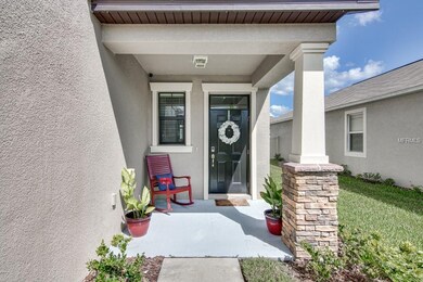 COVERED FRONT ENTRY DOOR WITH PROGRAMMABLE KEY-LES