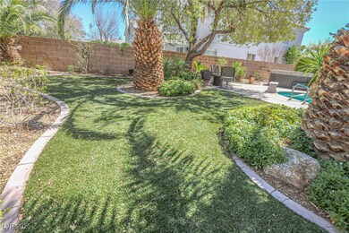 View of yard featuring a fenced backyard and a pat