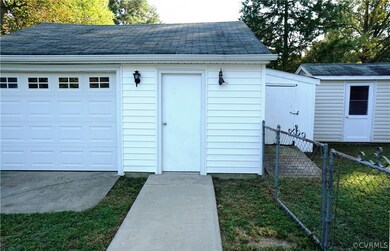 Oversized garage and Workshop with electricity and multiple sheds.