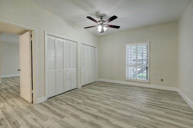 This room features light wood flooring, a ceiling