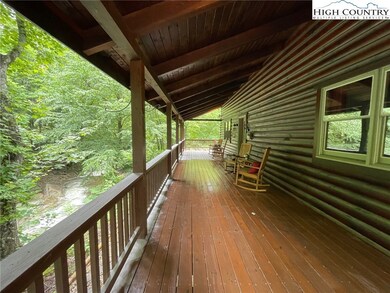 Covered front porch to relax and listen to the sou