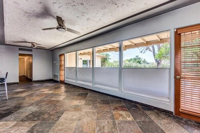 picture windows, natural stone flooring