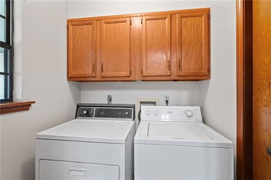 Laundry room has a pantry and sink!
