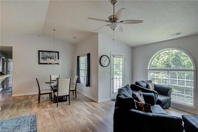 Large Window with lots of natural light leading out to the balcony