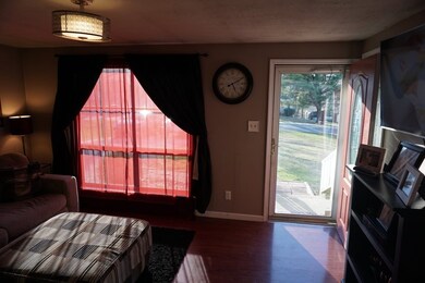 Spacious living room area with picture window and 