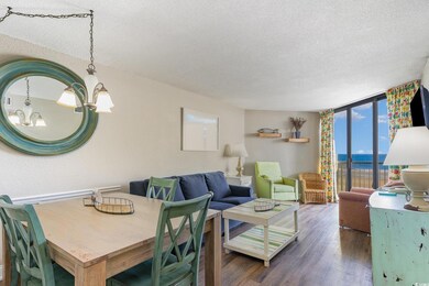 Dining space with dark wood-type flooring, floor t