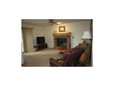 Family Room Open to Kitchen; Fireplace w Brick Hea